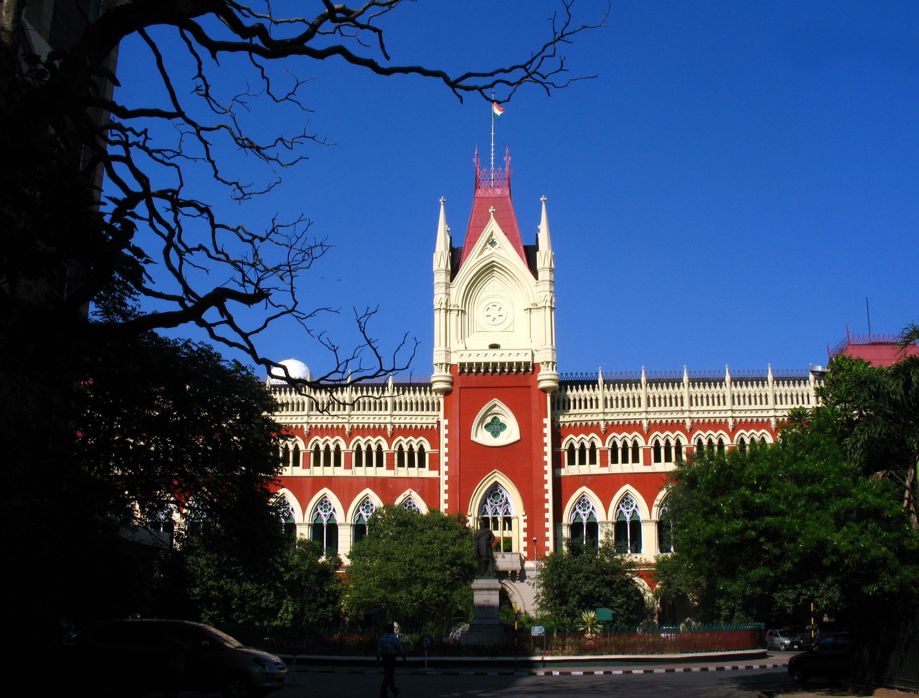 The Gothic red and white facade of the Calcutta High Court in Kolkata